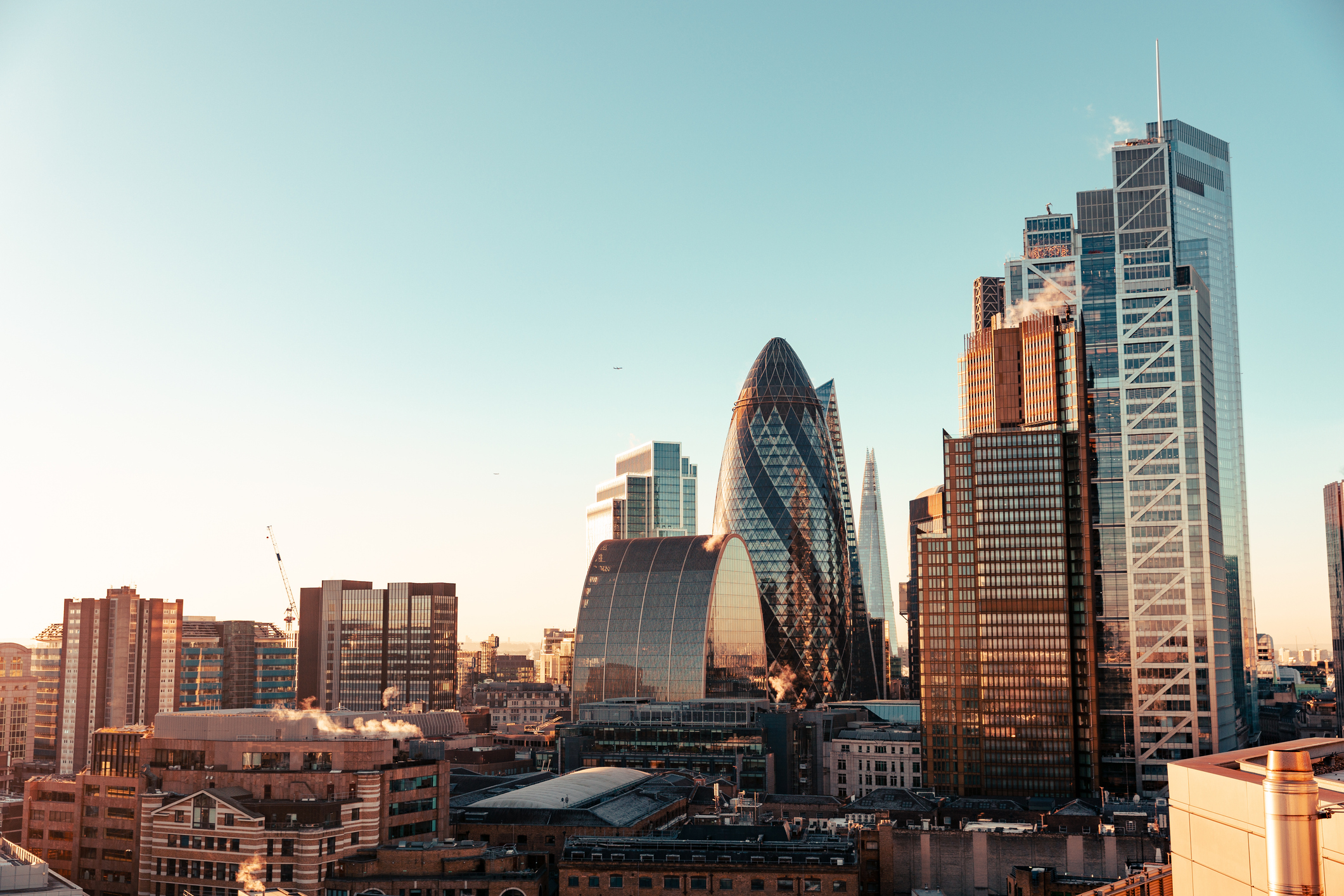 Sun setting over buildings in London